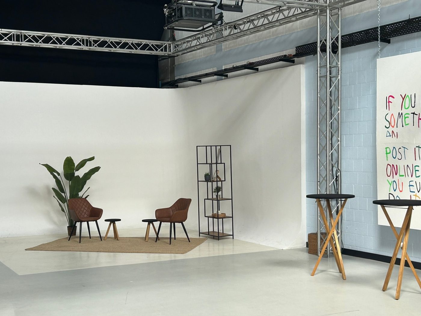 White cyclorama in the studio with two armchairs for an interview