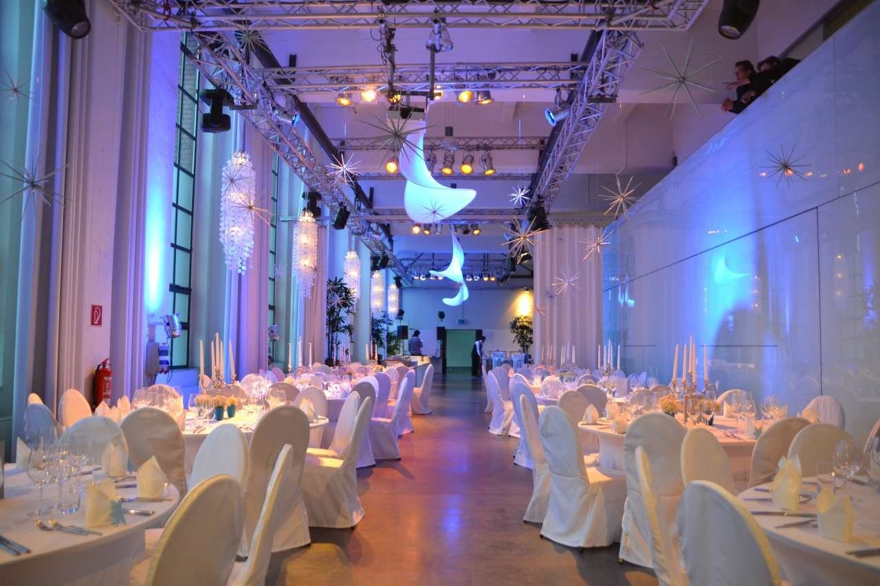 Long tables in the festively lit hall at Bauwerk